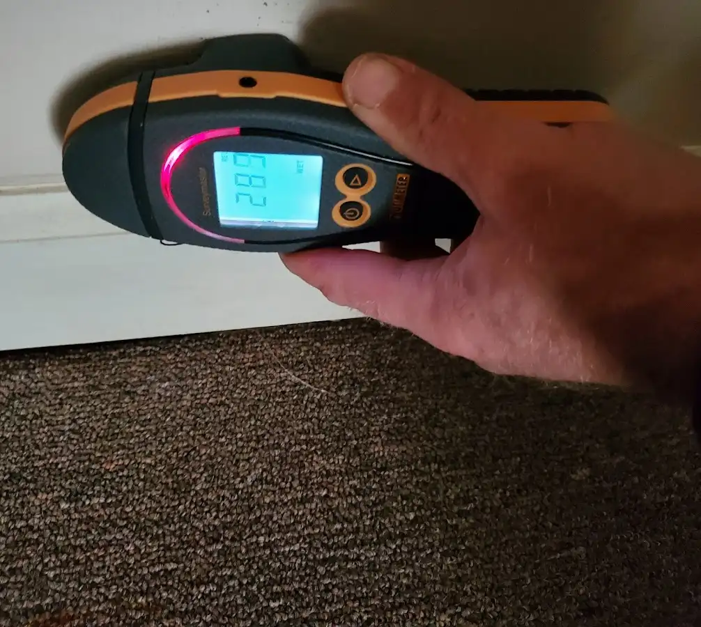 Moisture detection at baseboard during Storm Damage Restoration in Villa Park